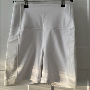 Fabletics PowerHold Biker Shorts w/ Pockets (White | S)